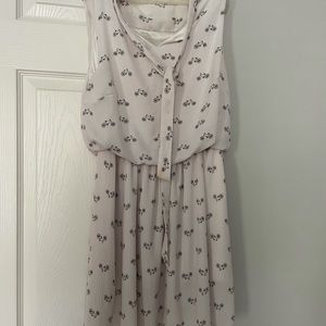 Ivory sleeveless dress with bicycle print